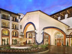 Completed guest entry drive and porte-cochere with fountain and mosaic tile trim.